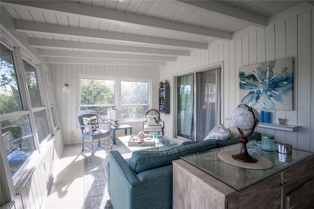 living area featuring beamed ceiling