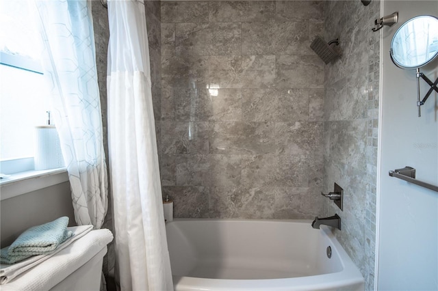 bathroom featuring shower / bath combination with curtain