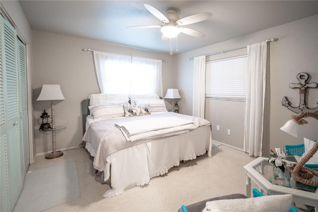 bedroom featuring baseboards, ceiling fan, and carpet floors