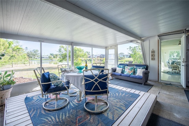 sunroom / solarium with outdoor lounge area and plenty of natural light