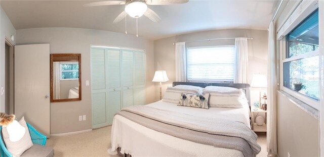 512 Shamrock Blvd, Venice, FL 34293 - bedroom with multiple windows, a closet, light carpet, lofted ceiling, and a ceiling fan