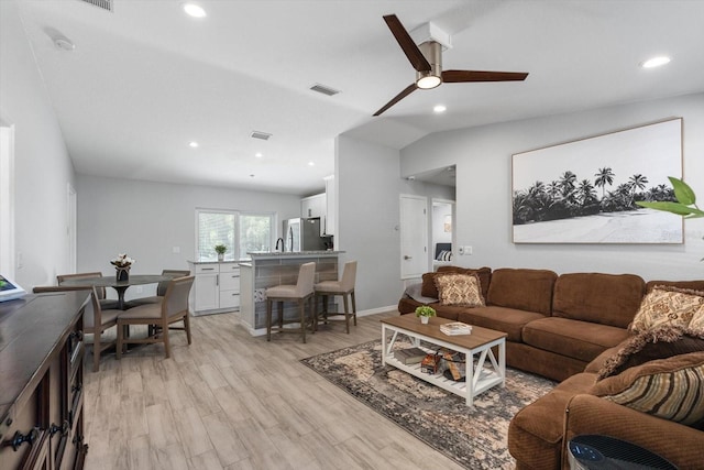 living room with a ceiling fan, recessed lighting, light wood-style flooring, and visible vents
