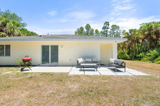 rear view of house with a lawn, a patio, and outdoor lounge area