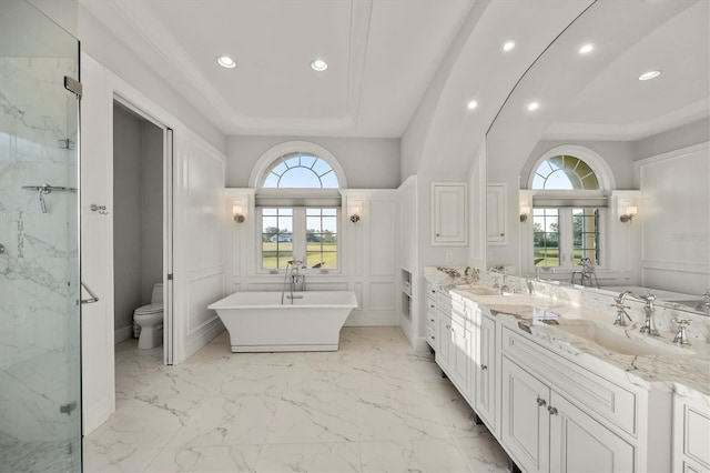full bath featuring vanity, a marble finish shower, a decorative wall, and toilet