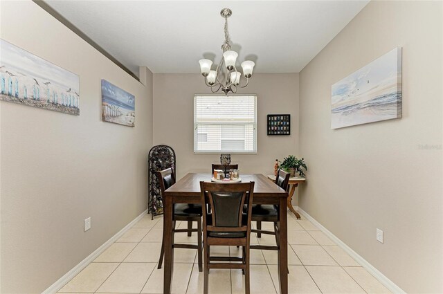 6546 Blue Grosbeak Cir, Lakewood Ranch, FL 34202 - dining space featuring light tile patterned flooring, a chandelier, and baseboards
