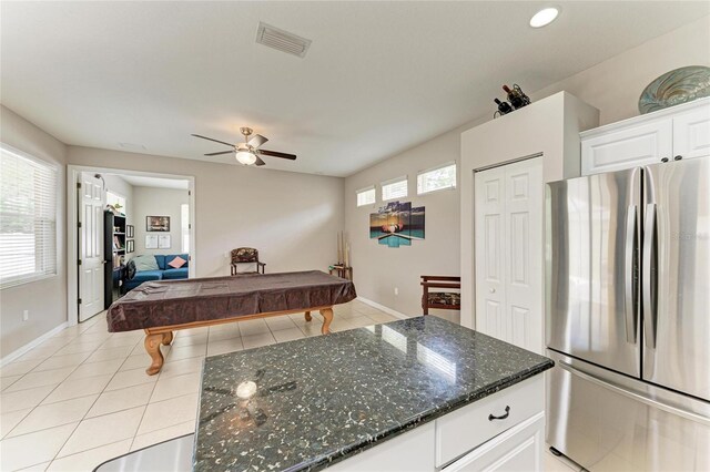 6546 Blue Grosbeak Cir, Lakewood Ranch, FL 34202 - kitchen with freestanding refrigerator, billiards, ceiling fan, white cabinetry, and baseboards