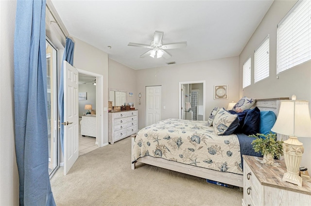 6546 Blue Grosbeak Cir, Lakewood Ranch, FL 34202 - bedroom with light colored carpet, ensuite bath, a ceiling fan, and a closet