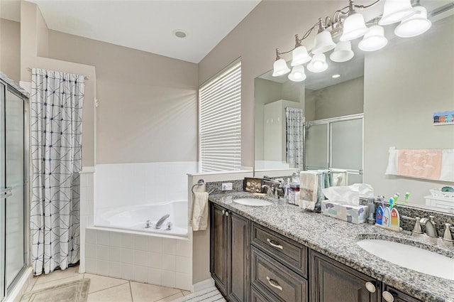 6546 Blue Grosbeak Cir, Lakewood Ranch, FL 34202 - full bath with a stall shower, double vanity, a garden tub, and tile patterned floors