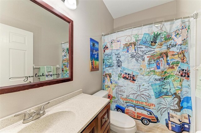6546 Blue Grosbeak Cir, Lakewood Ranch, FL 34202 - bathroom featuring vanity, toilet, and curtained shower
