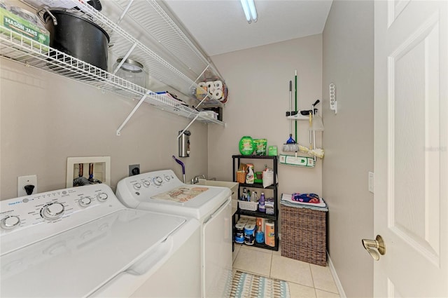 6546 Blue Grosbeak Cir, Lakewood Ranch, FL 34202 - washroom featuring washer and dryer, tile patterned floors, and baseboards