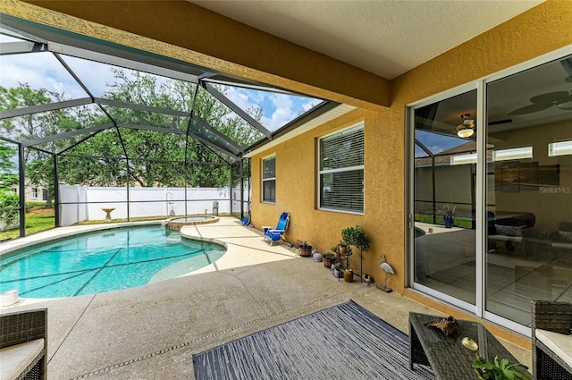 6546 Blue Grosbeak Cir, Lakewood Ranch, FL 34202 - view of pool featuring a patio area, a pool with connected hot tub, and glass enclosure