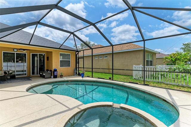 6546 Blue Grosbeak Cir, Lakewood Ranch, FL 34202 - view of pool featuring a patio, a pool with connected hot tub, and glass enclosure