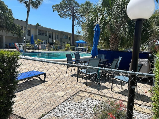 21300 Brinson Ave Unit 214, Port Charlotte, FL 33952 - community pool featuring a patio