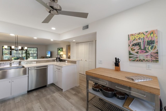 536 Lakeside Dr Unit 0, Bradenton, FL 34210 - kitchen with dishwasher, a sink, light wood-style flooring, white cabinets, and recessed lighting