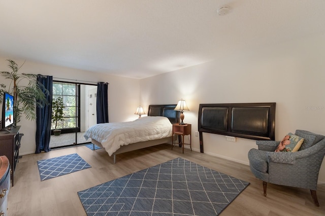 536 Lakeside Dr Unit 0, Bradenton, FL 34210 - bedroom with wood finished floors and baseboards