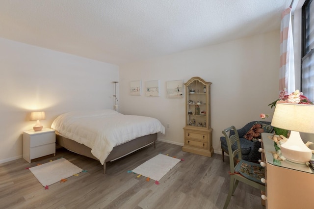 536 Lakeside Dr Unit 0, Bradenton, FL 34210 - bedroom with wood finished floors and baseboards