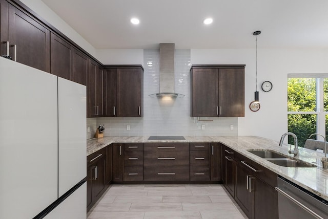 kitchen featuring stainless steel dishwasher, freestanding refrigerator, wall chimney range hood, black electric cooktop, and a sink
