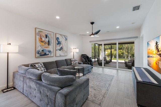 living area featuring visible vents, ceiling fan, recessed lighting, and light wood-style floors
