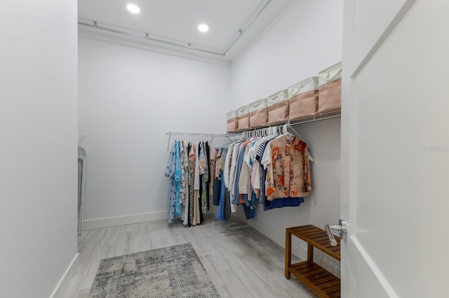 spacious closet with light wood-style floors
