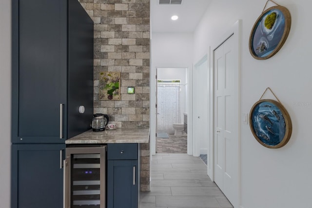 bar with fridge, recessed lighting, visible vents, a dry bar, and beverage cooler