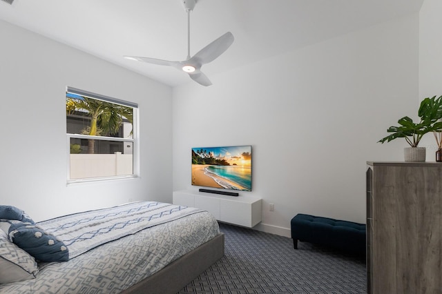 bedroom with carpet flooring, ceiling fan, and baseboards