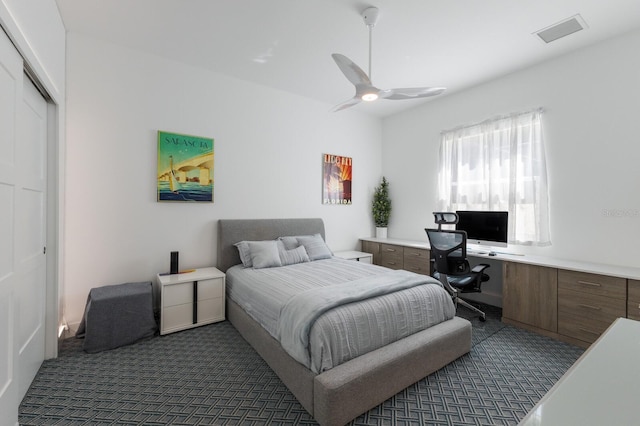 bedroom featuring visible vents, a ceiling fan, and carpet floors