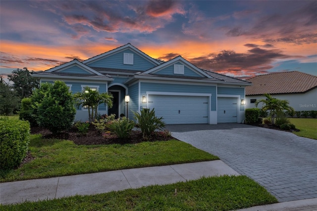 13319 Deep Blue Pl, Bradenton, FL 34211 - single story home with decorative driveway, an attached garage, and a front yard