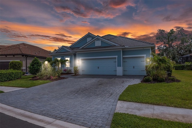 13319 Deep Blue Pl, Bradenton, FL 34211 - single story home featuring decorative driveway, an attached garage, a front yard, and a tile roof