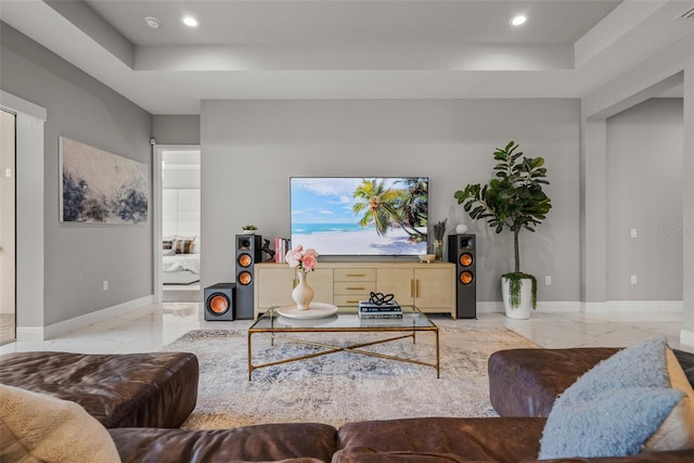 13319 Deep Blue Pl, Bradenton, FL 34211 - living room featuring marble tiled floors, a raised ceiling, recessed lighting, and baseboards