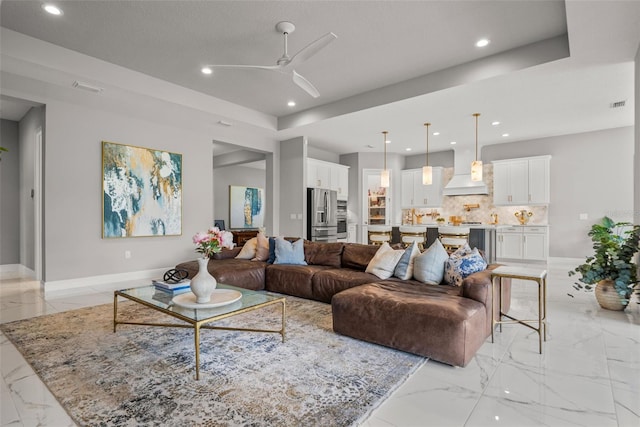 13319 Deep Blue Pl, Bradenton, FL 34211 - living area with recessed lighting, ceiling fan, light marble finish floors, and baseboards