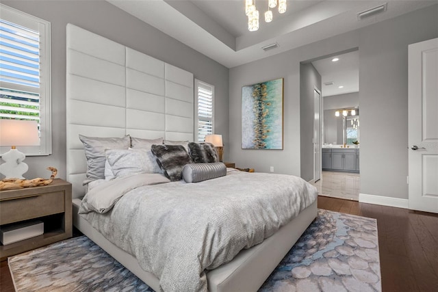 13319 Deep Blue Pl, Bradenton, FL 34211 - bedroom with dark wood finished floors, baseboards, recessed lighting, and ensuite bathroom