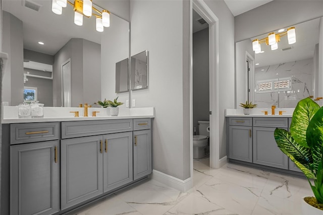 13319 Deep Blue Pl, Bradenton, FL 34211 - full bathroom featuring marble look tiles, vanity, baseboards, toilet, and a marble finish shower