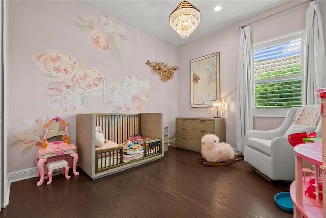 13319 Deep Blue Pl, Bradenton, FL 34211 - bedroom with a chandelier, wood finished floors, a nursery area, baseboards, and recessed lighting