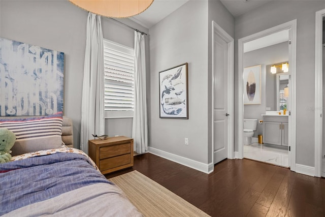 13319 Deep Blue Pl, Bradenton, FL 34211 - bedroom featuring baseboards, wood finished floors, and ensuite bath