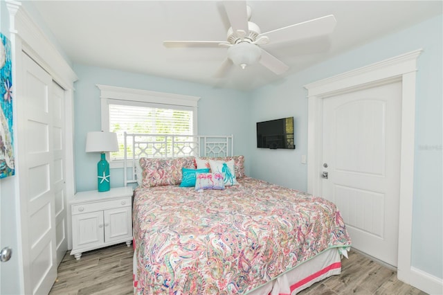 205 Elm Ave, Anna Maria, FL 34216 - bedroom featuring ceiling fan, light wood-type flooring, and a closet