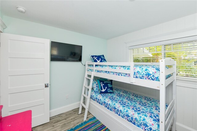 205 Elm Ave, Anna Maria, FL 34216 - bedroom featuring baseboards and wood finished floors