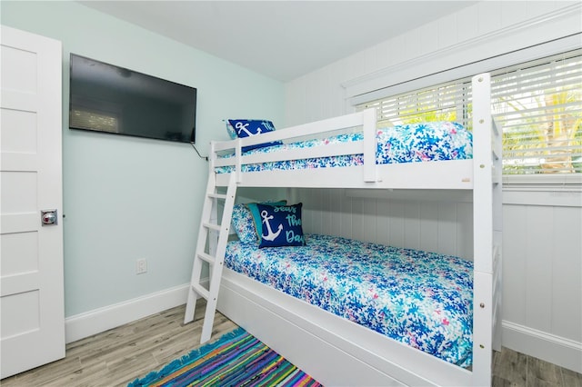 205 Elm Ave, Anna Maria, FL 34216 - bedroom featuring baseboards and wood finished floors