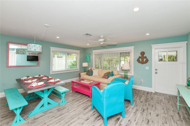 205 Elm Ave, Anna Maria, FL 34216 - living room with visible vents, a wealth of natural light, wood finished floors, and baseboards