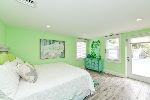 205 Elm Ave, Anna Maria, FL 34216 - bedroom with recessed lighting, wood finished floors, access to outside, baseboards, and visible vents