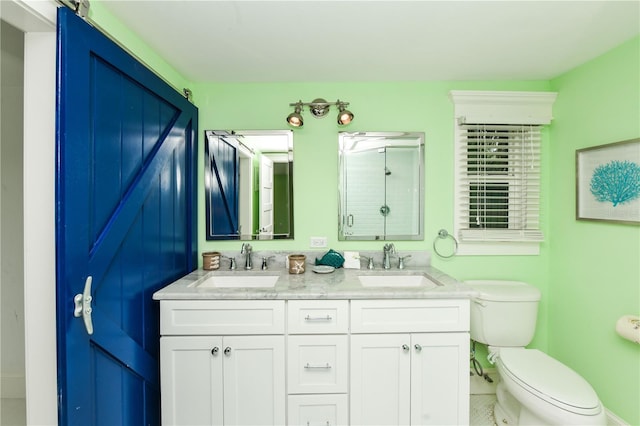 205 Elm Ave, Anna Maria, FL 34216 - bathroom featuring toilet, double vanity, a sink, and a shower with door