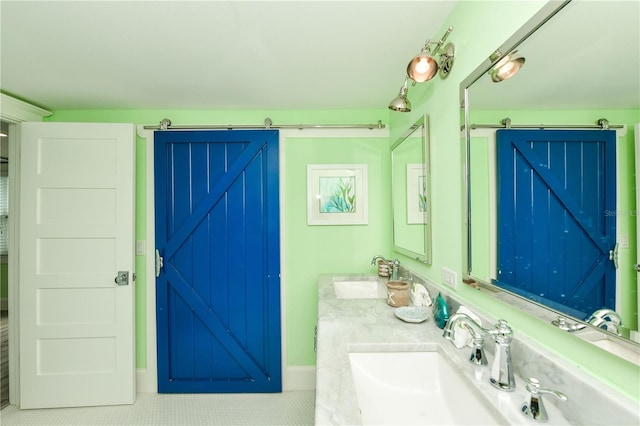205 Elm Ave, Anna Maria, FL 34216 - bathroom with double vanity, tile patterned flooring, and a sink