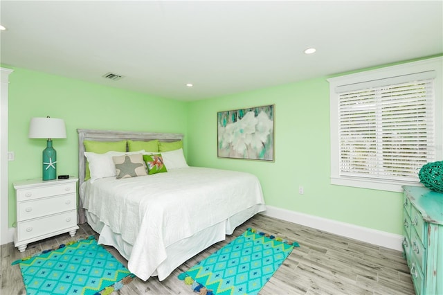 205 Elm Ave, Anna Maria, FL 34216 - bedroom with wood finished floors, visible vents, recessed lighting, and baseboards