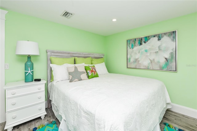 205 Elm Ave, Anna Maria, FL 34216 - bedroom with baseboards, visible vents, wood finished floors, and recessed lighting