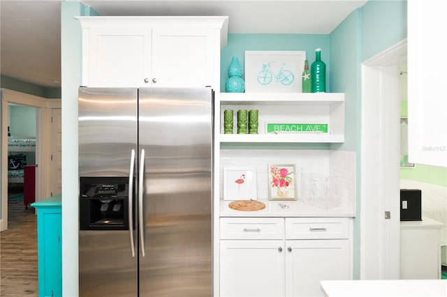 205 Elm Ave, Anna Maria, FL 34216 - kitchen with white cabinetry, open shelves, light countertops, wood finished floors, and stainless steel fridge with ice dispenser