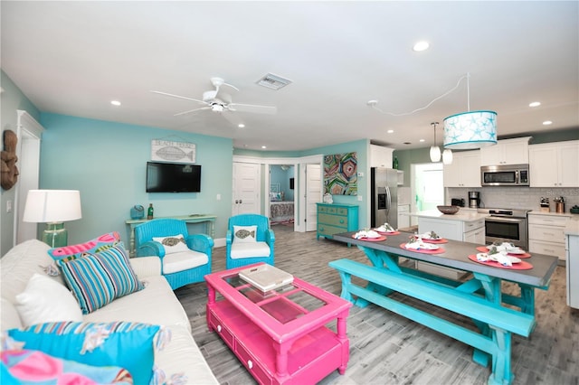 205 Elm Ave, Anna Maria, FL 34216 - living room featuring visible vents, recessed lighting, ceiling fan, baseboards, and light wood-type flooring