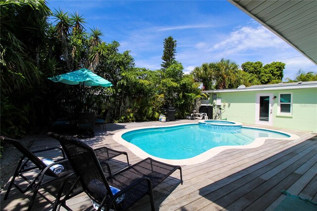 205 Elm Ave, Anna Maria, FL 34216 - view of pool with a wooden deck and a pool with connected hot tub