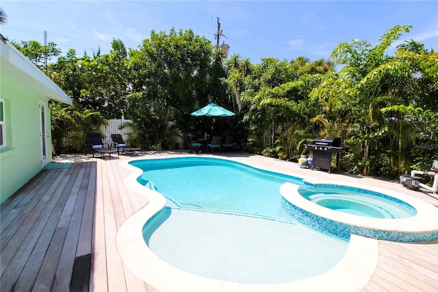 205 Elm Ave, Anna Maria, FL 34216 - view of swimming pool with a deck, fence, a patio, area for grilling, and a pool with connected hot tub