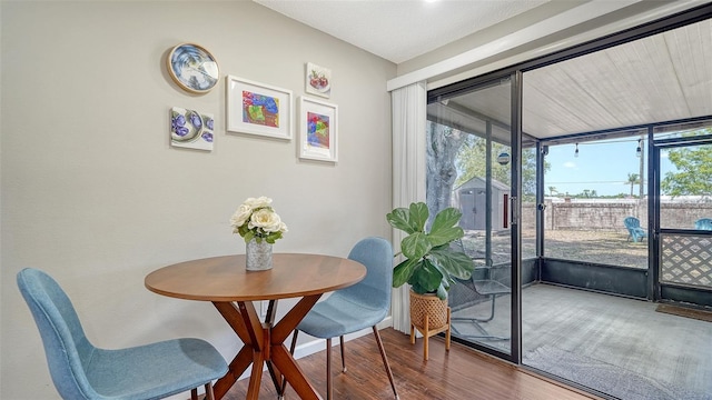 dining space featuring wood finished floors