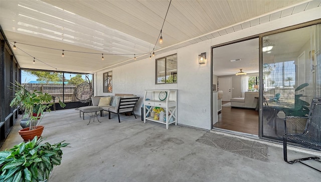 view of patio featuring fence