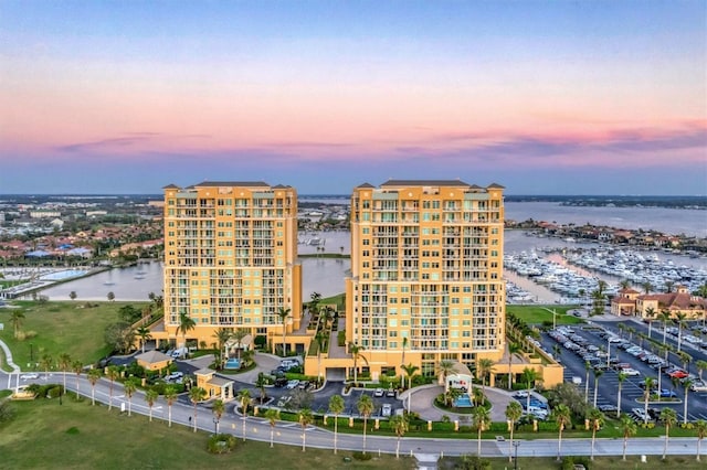 130 Riviera Dunes Way Unit 903, Palmetto, FL 34221 - property at dusk with a water view and a view of apartment building / complex